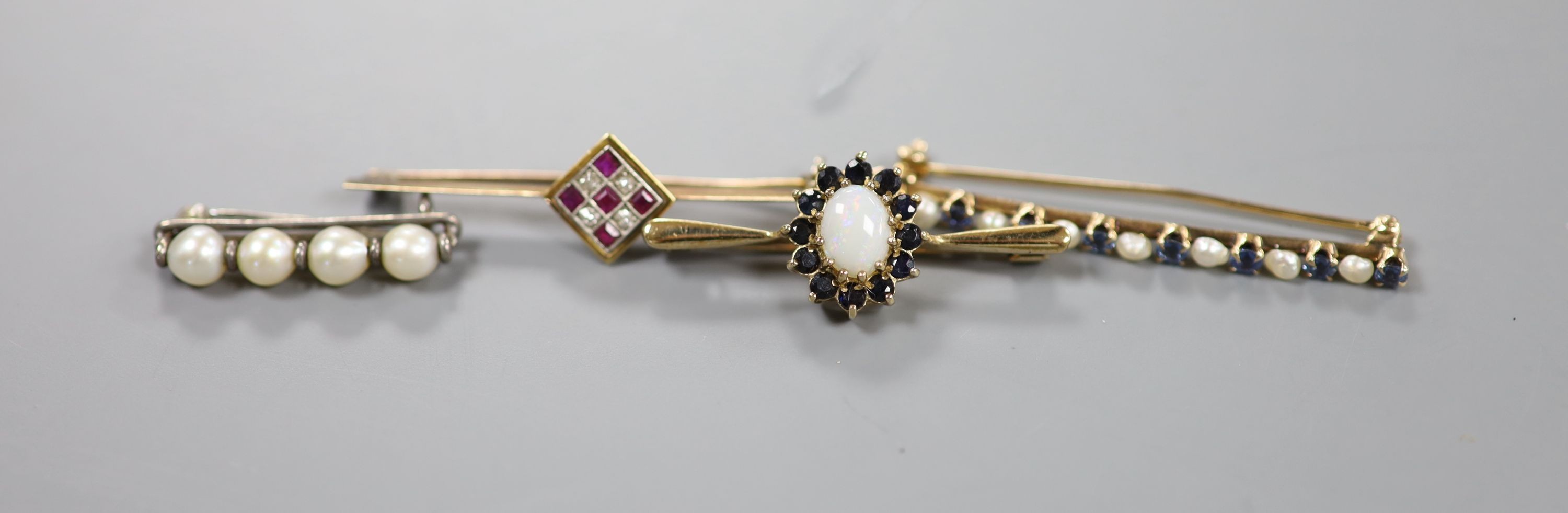 Two yellow metal and gem set bar brooches including ruby and diamond cluster, 46mm, gross 4.3 grams, a modern 9ct gold, white opal and sapphire cluster bar brooch, gross 3.1 grams and a cultured pearl set bar brooch.